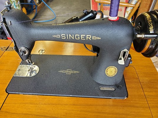 Singer 66 with textured Godzilla finish in a wooden table